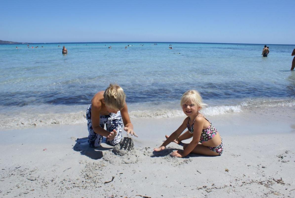 Kids on the beach of San Teodoro in Sardinia